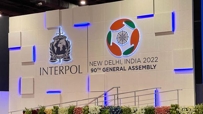 Logo of INTERPOL and the 90th General Assembly of INTERPOL in New Delhi