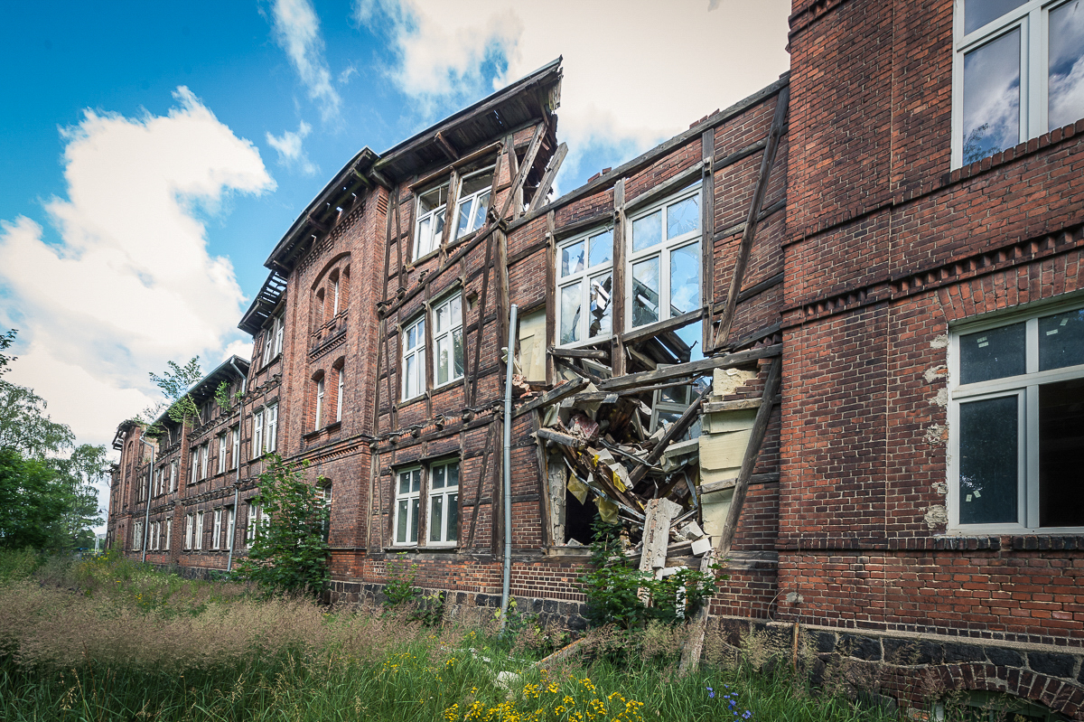 Devastated former KL Soldau building in Działdowo, collapsed parts of the roof and building walls